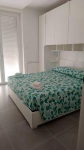 Ένα ή περισσότερα κρεβάτια σε δωμάτιο στο Appartamento fronte mare - Grottammare