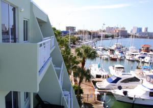 a view from a balcony of a marina with boats at Chart House Suites on Clearwater Bay in Clearwater Beach