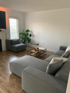 a living room with a couch and a table at Modern Detached Home in the Suburbs of Toronto in Ajax