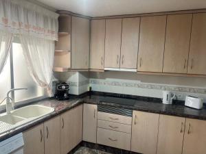 Kuchyňa alebo kuchynka v ubytovaní Homely Apartments Centro