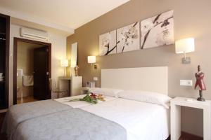 Postel nebo postele na pokoji v ubytování Dormavalencia Hostel Regne