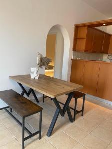 a wooden table and bench in a kitchen at Sofianna's oasis in Kalloni Tinou +27 photos