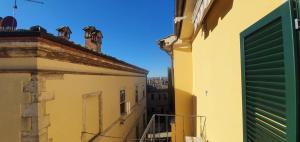 a view from the balcony of a building at Marivò Apartment in Rapolano Terme