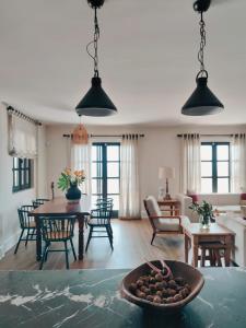 a living room with a table with a bowl of food at Viento Villa in Cesme