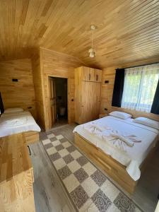 Postel nebo postele na pokoji v ubytování Olympos Yavuz Hotel