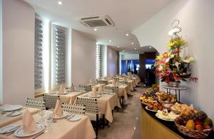 Reštaurácia alebo iné gastronomické zariadenie v ubytovaní Orla Copacabana Hotel