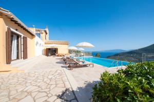 a villa with a swimming pool with a view at Adamas Villa in Sivota