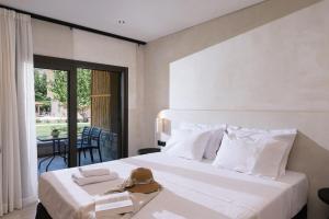 Postel nebo postele na pokoji v ubytování Idi Hotel + 37 fotografií