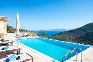 a villa with a pool and a view at Adamas Villa in Sivota