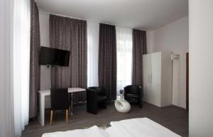 TV a/nebo společenská místnost v ubytování Hotel Luisenhof