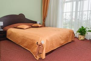 Postel nebo postele na pokoji v ubytování Terminal-A Hotel