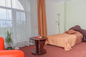 Postel nebo postele na pokoji v ubytování Terminal-A Hotel