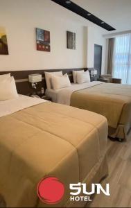 Ліжко або ліжка в номері Hotel Sun