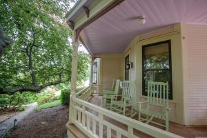 a porch with rocking chairs and a window at 254 South Union Street Guest House in Burlington