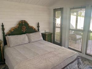 A bed or beds in a room at Cueva Romana Cave House, Clothing Optional, Adult Only