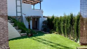A garden outside Cueva Romana Cave House, Clothing Optional, Adult Only