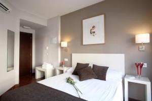 Postel nebo postele na pokoji v ubytování Dormavalencia Hostel Regne