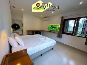Cama ou camas em um quarto em Pousada Vila do Sol Juquehy