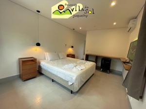 Cama ou camas em um quarto em Pousada Vila do Sol Juquehy