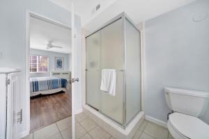 a bathroom with a shower and a toilet at 1404 W Oceanfront A in Newport Beach