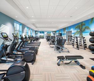 a gym with a row of treadmills and exercise bikes at Margaritaville Beach Resort Ft Myers Beach in Fort Myers Beach
