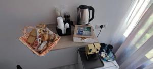 a table with a shelf with a basket of food on it at B&B PalmaViola in Caserta