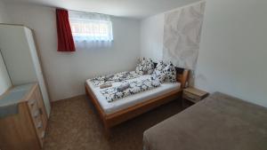 Posteľ alebo postele v izbe v ubytovaní BerBe Apartman