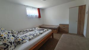Posteľ alebo postele v izbe v ubytovaní BerBe Apartman