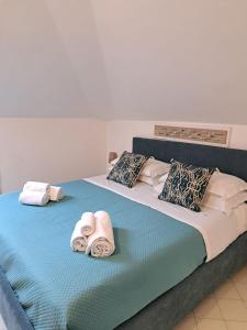 a bedroom with two beds with towels on them at Mim&igrave; sul Mare in Massa Lubrense