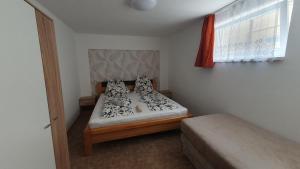 Posteľ alebo postele v izbe v ubytovaní BerBe Apartman