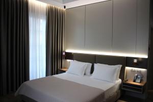Voodi või voodid majutusasutuse Hotel Monarch toas