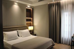 Voodi või voodid majutusasutuse Hotel Monarch toas