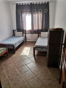 Una cama o camas en una habitación de Un Charmant appartement à Cabo Nego Complexe Mouna