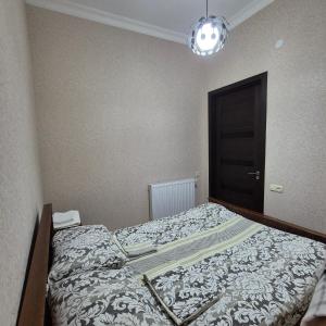 Postel nebo postele na pokoji v ubytování Apartment Cozy House 1