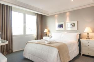 Cama ou camas em um quarto em Plaza São Rafael Hotel
