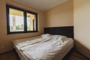 Łóżko lub łóżka w pokoju w obiekcie Apartamenty Wilk