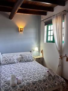 Postel nebo postele na pokoji v ubytování Vivienda vacacional El Lagarto