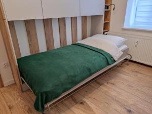 Ένα ή περισσότερα κρεβάτια σε δωμάτιο στο Apartament Joanna