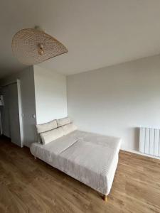 Ένα ή περισσότερα κρεβάτια σε δωμάτιο στο Appartement avec vue sur le lac +23 φωτογραφίες