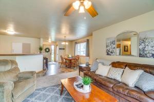a living room with a couch and a table at Cozy Sioux Falls House - Walk to Park! in Sioux Falls