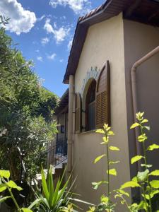 a house with a window on the side of it at Varagas Bliss in Sívros