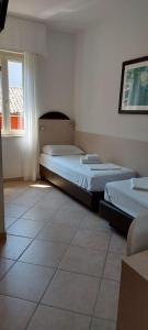 Postel nebo postele na pokoji v ubytování Hotel Sirena