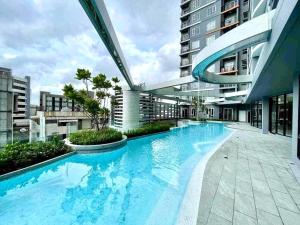 a large swimming pool in the middle of a building at DiamondHouse in Hat Yai