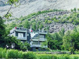 a house on the side of a hill at Alpine Resort Khaplu in Khaplu