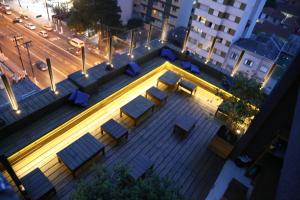 an overhead view of a building with benches and lights at Bê Hotel in Sao Paulo