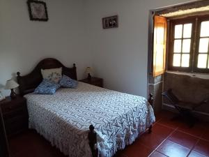 Ένα ή περισσότερα κρεβάτια σε δωμάτιο στο Casa das Guimarães