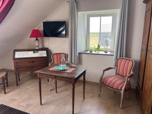 TV a/nebo společenská místnost v ubytování Chambre d'hotes "L'étable d'irène"