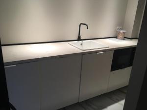 a white kitchen counter with a sink in it at Hacienda Soto-Hego Haizea in Chiclana de la Frontera