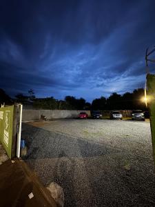 a parking lot at night with cars parked in it at HOTEL CENTRAL MARGARITA in Boa Vista