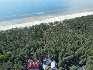 an aerial view of a house and the beach at Kopų draugai in Palanga